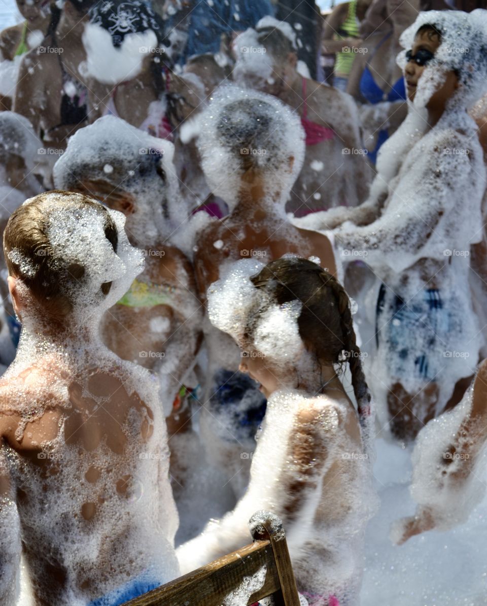 foamy disco. Children and adults have fun and dance in soap suds
