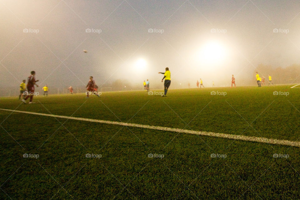 Soccer game in fog
