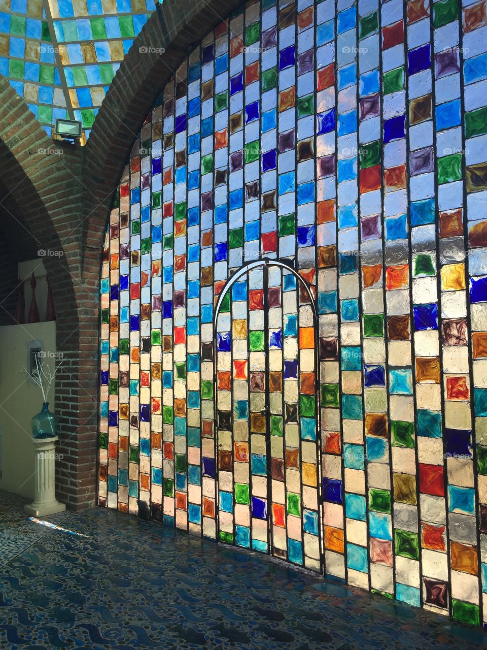 Stunning blue, green yellow, red and white curved glass wall in a glass shop in Cabo San Lucas in the Mexican Riviera