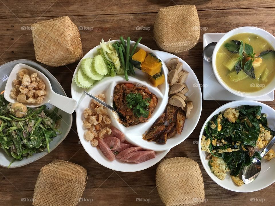 Full dishes are filled with Thai Northern food. Generally, the food is served with a small box of sticky rice.