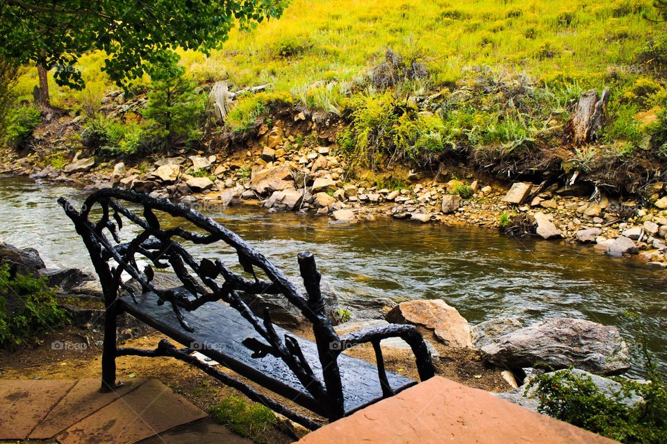 River Park Bench. A park bench in Estes Park Co. Expertly crafted to look rustic.  