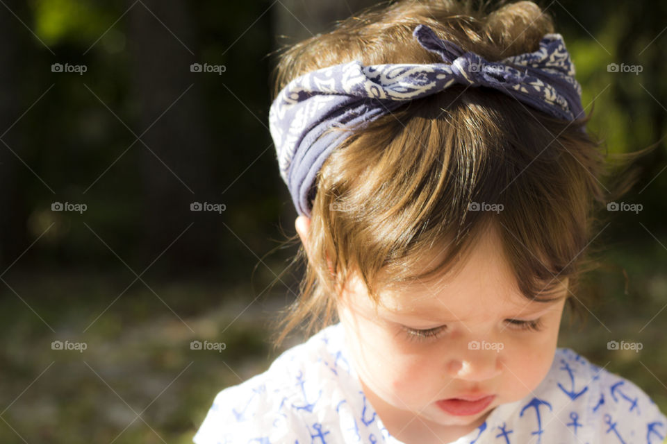 curious baby. what's that she's looking at?