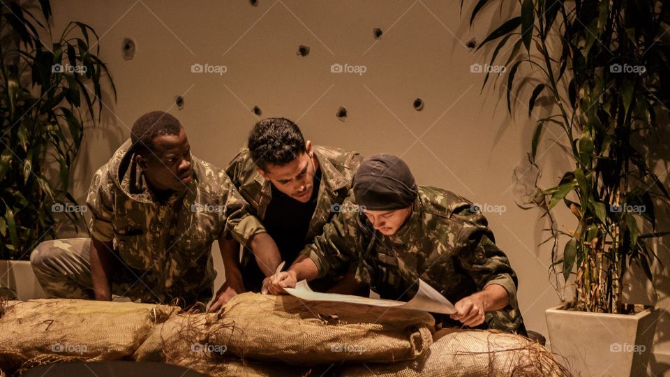 Military soldiers looking into the map