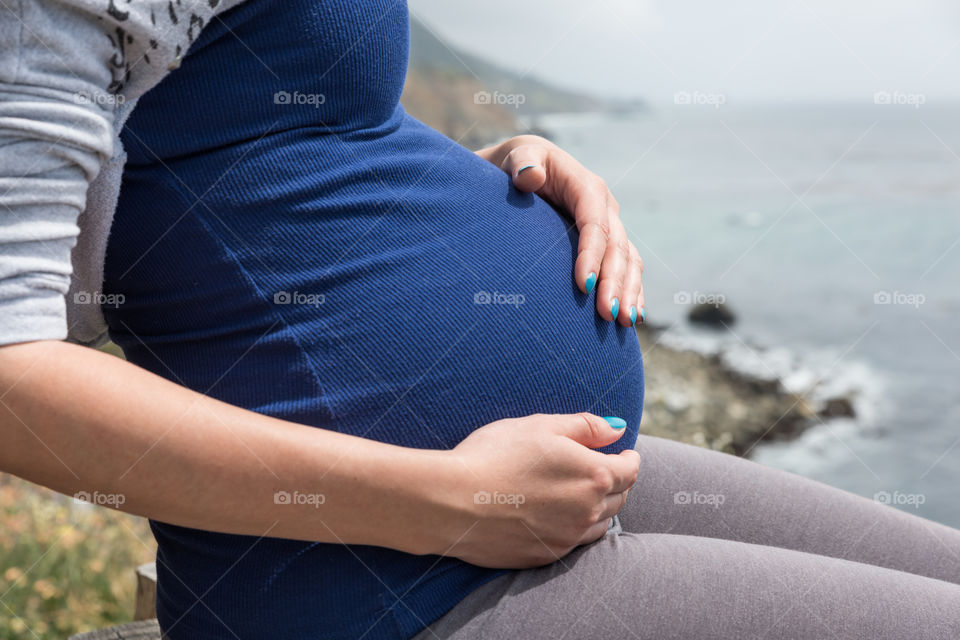 pregnant woman by the ocean