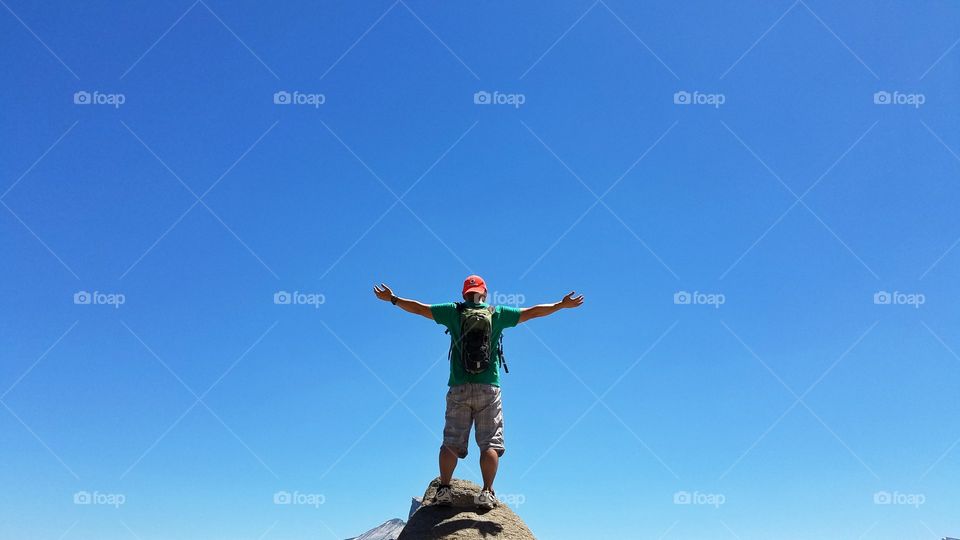 Standing on the top of the mountain