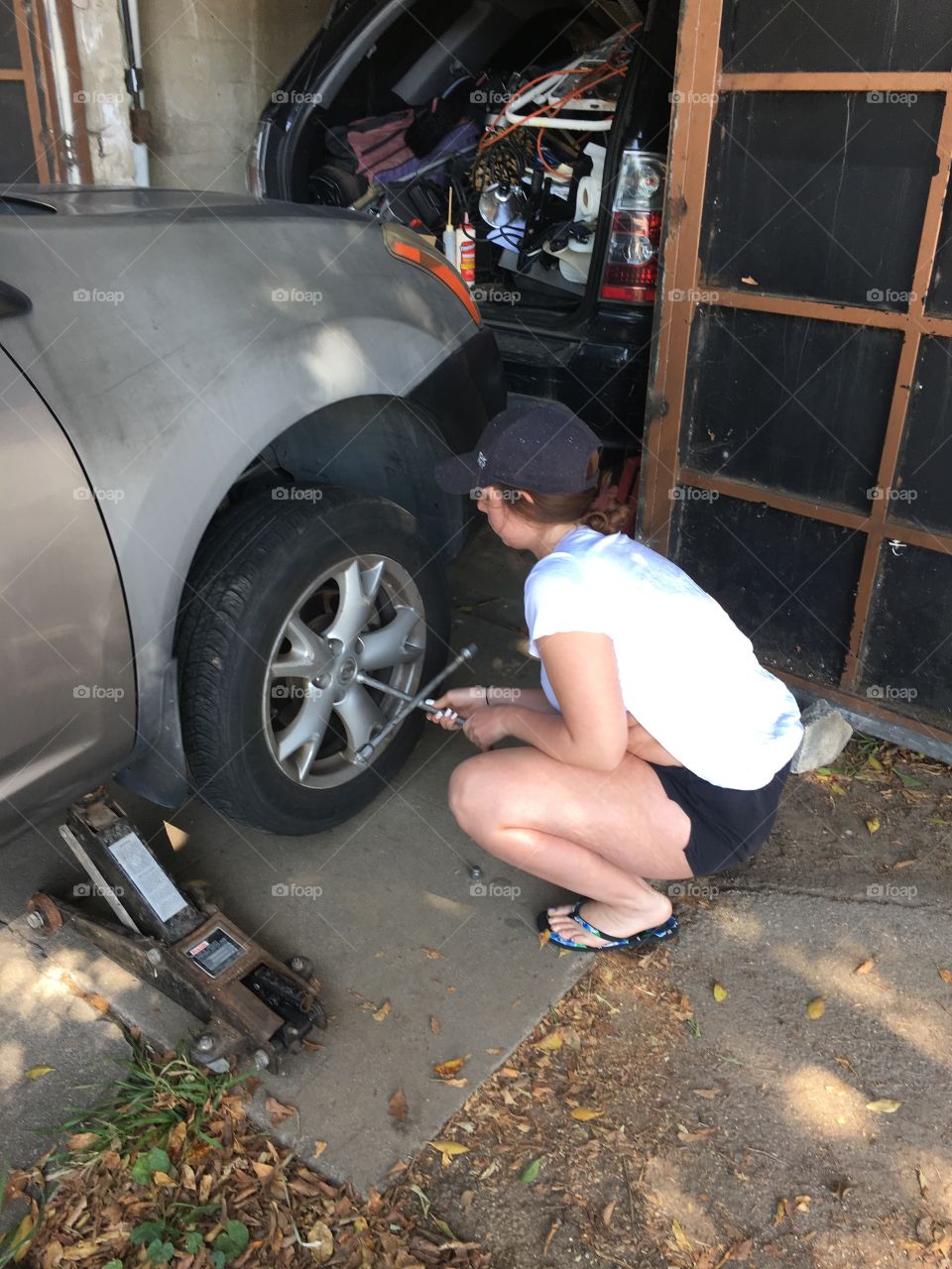 Working on her car
