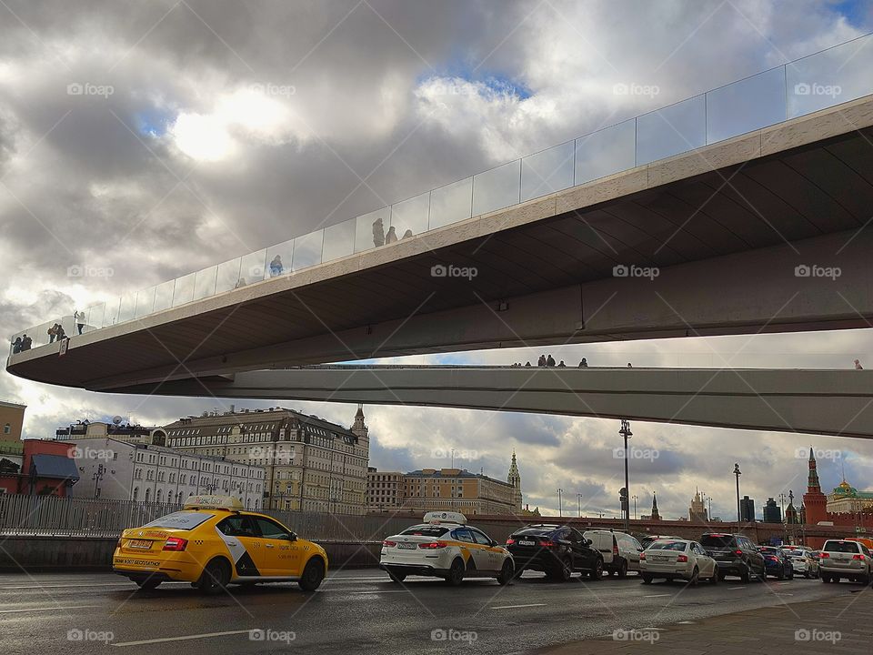 Moscow. "Soaring Bridge". Observation deck of the Zaryadye park. View from the Moskvoretskaya embankment. Red Square in the background, the Moscow Kremlin
