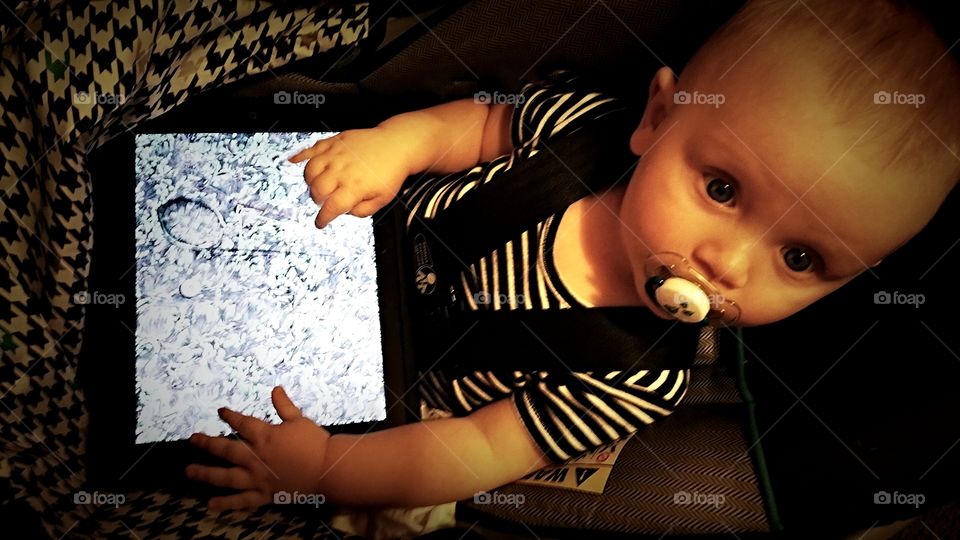 Baby using the digital tablet