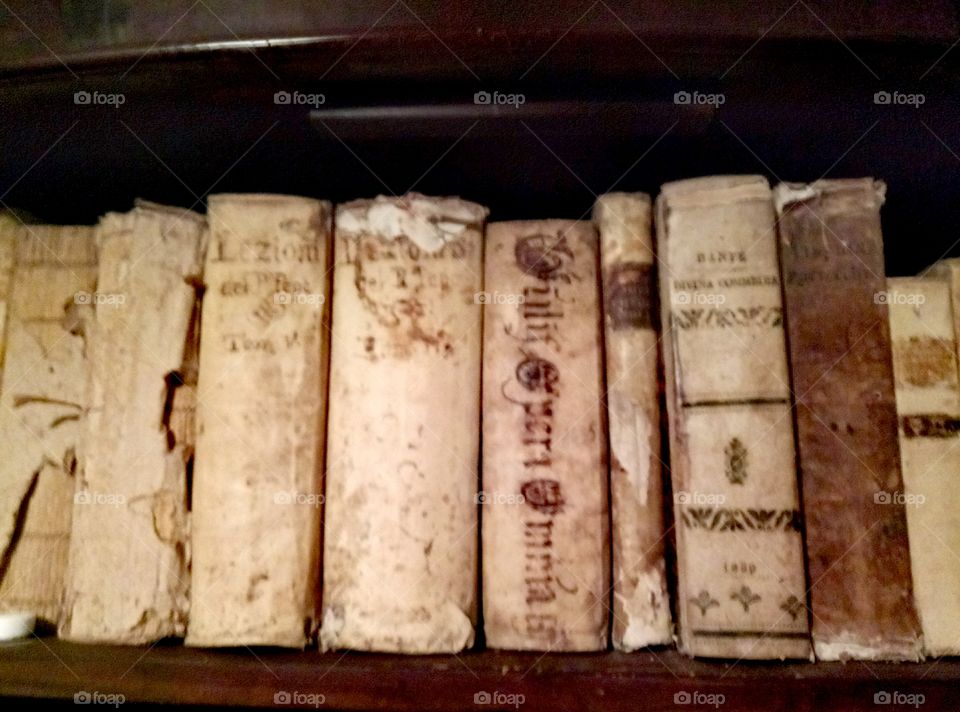 Ancient and precious thick books on a shelf