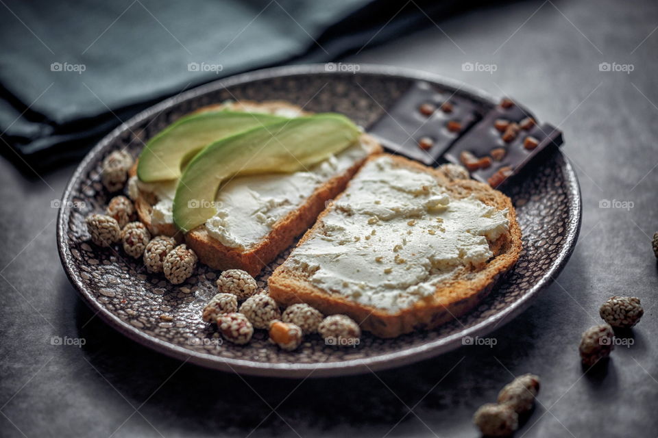 Dietary sandwiches of grain toasts with cream cheese and avocado