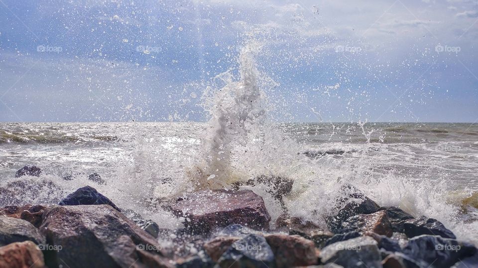 sea storm. summer. stones crush the waves. splashing