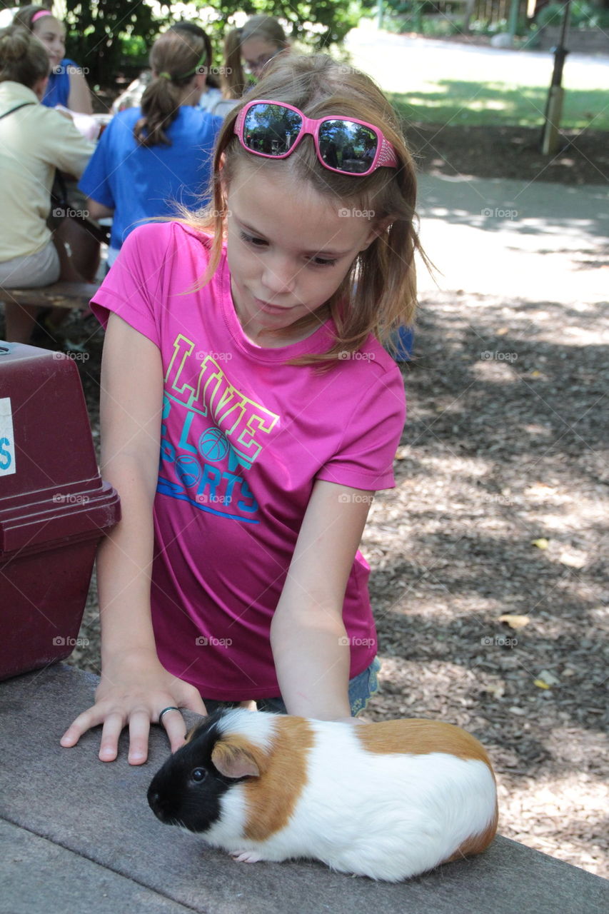girl with guinea pig