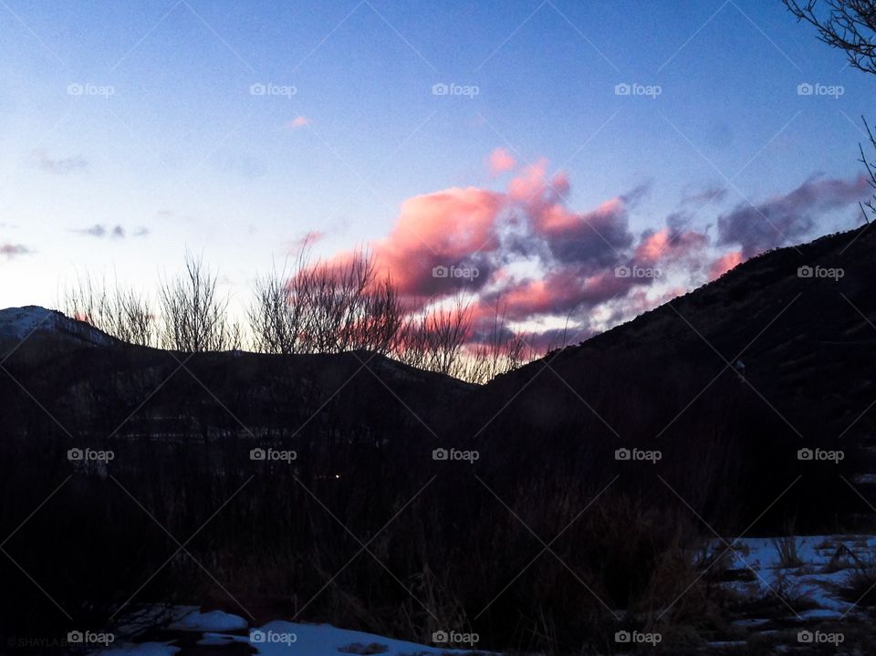 Dusky mountain winter skyline at sunset