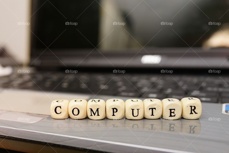 Close-up of dices on laptop
