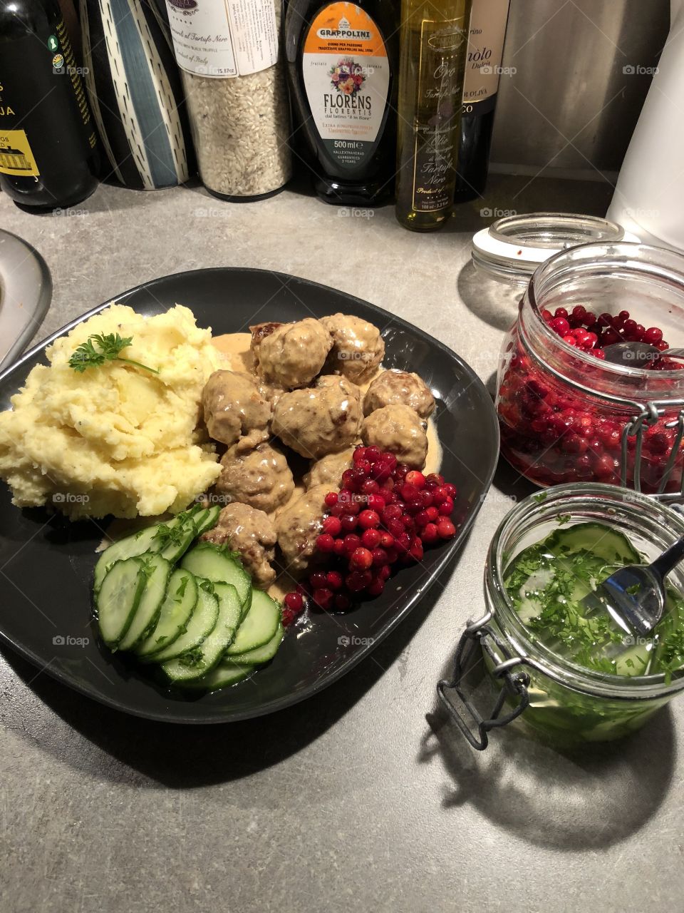 Swedish meatballs i gravy, with mash potato, pickled cucumber and sugary cranberries