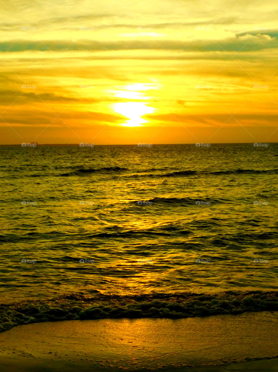 Warm Sensation! 
A brilliant sunset lingering over the Choctahatchee Bay radiating its sun rays!