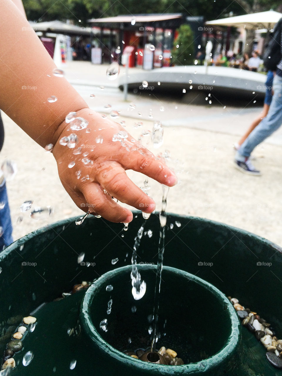 At a little water fountain, drinking water