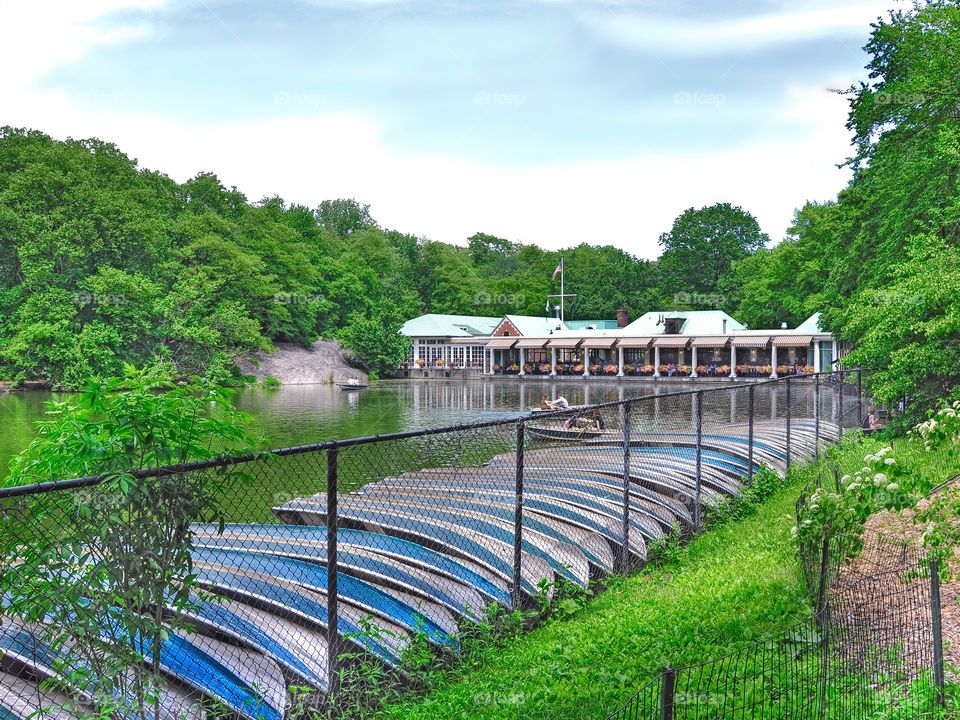 Famous Loeb Boat House . The iconic Loeb boathouse restaurant in New York's Central Park. Lined with rowboats and the famous pond.