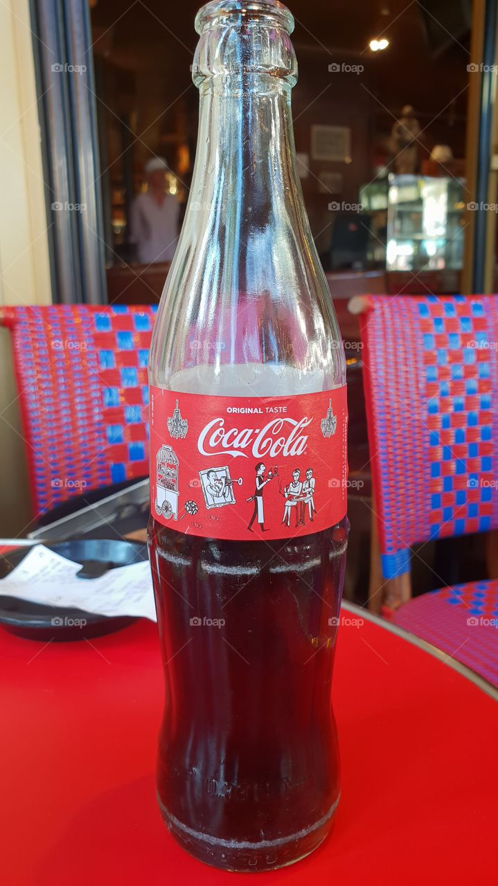 French bottle of coca cola with different draw of Paris quarter