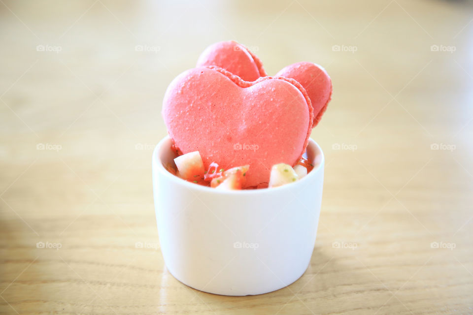 Pink heart shaped cookies as dessert and wood background, Valentine's Day concept.