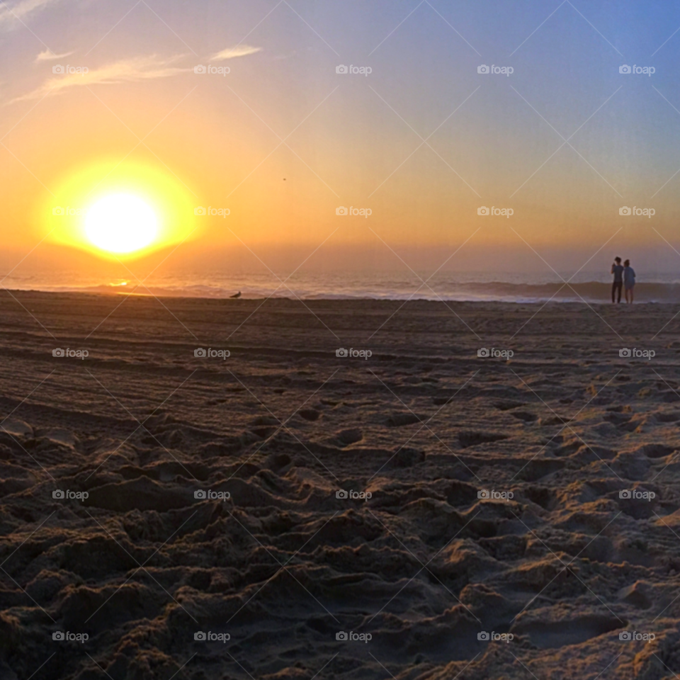 Sunrise in love. My brother and his girlfriend taking in the sunrise together in Ocean City, Maryland.