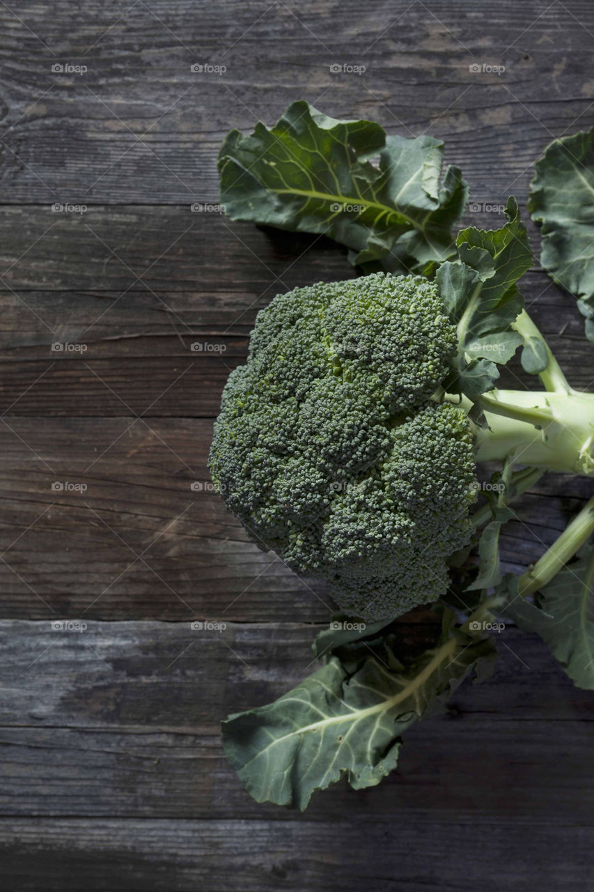 broccoli on wooden table