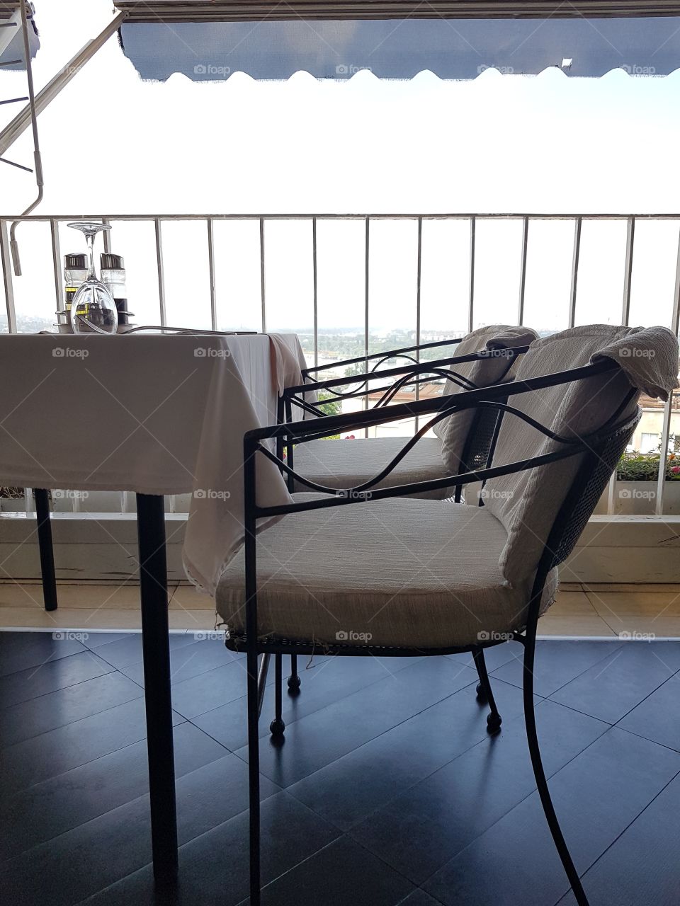table and chairs in restaurant on top of the building