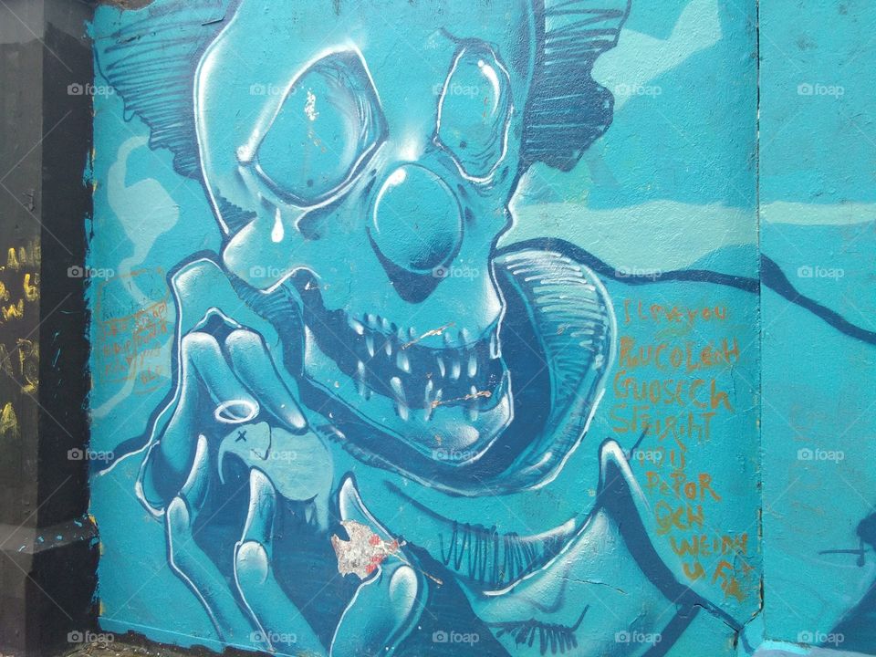 Graffiti are writing or drawings that have been scribbled, scratched, or painted illicitly on a wall or other surface, often within public view