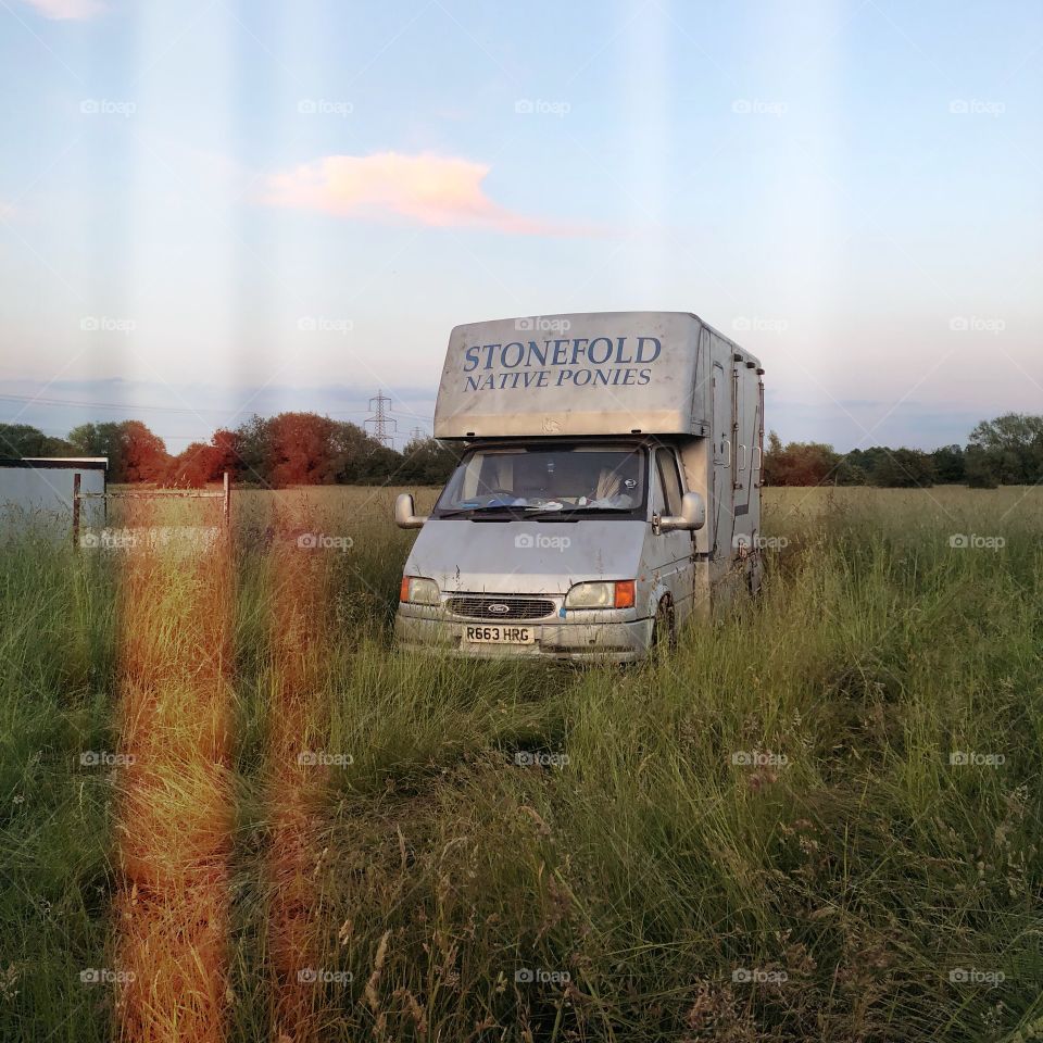 Abandoned Old van motor vehicle in a field 