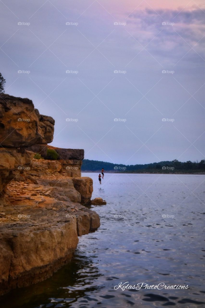 Jumping off the bluffs of the lake. Having summer fun. 