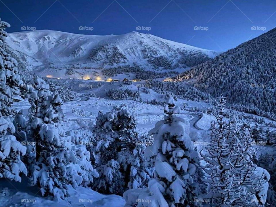 Beautiful dusk over snowy mountain background