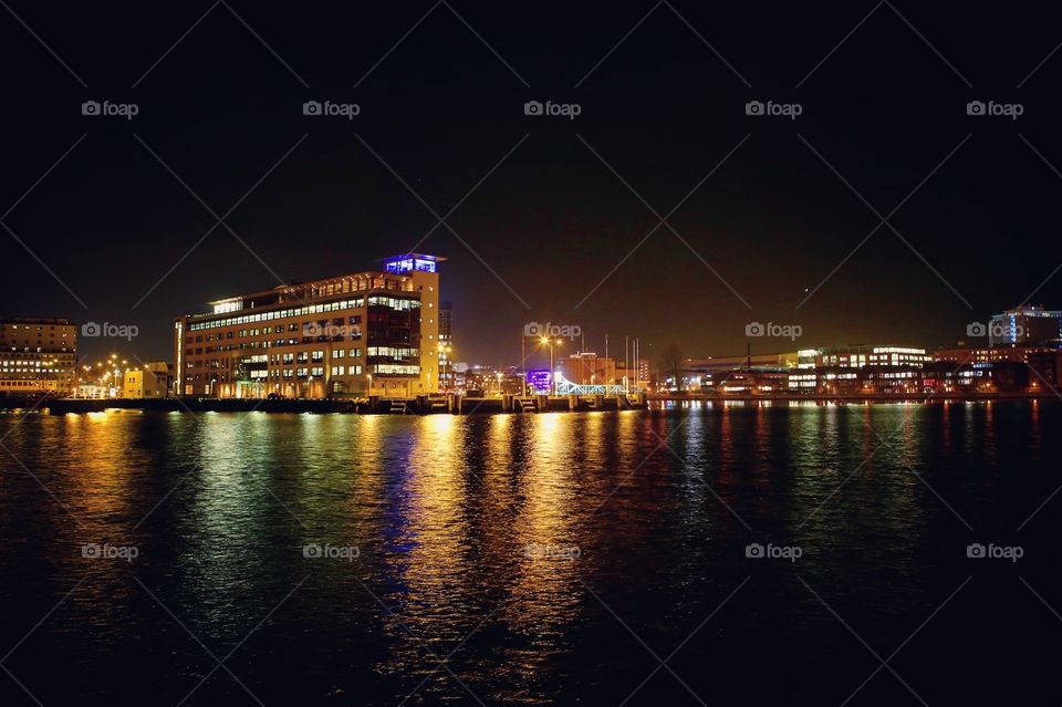 Night time city lights by the water