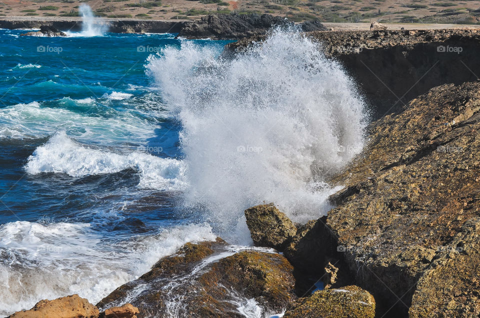 Big water splash in Aruba coast 