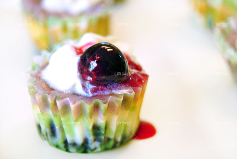 Mini cup cheesecakes with blueberry and frosting