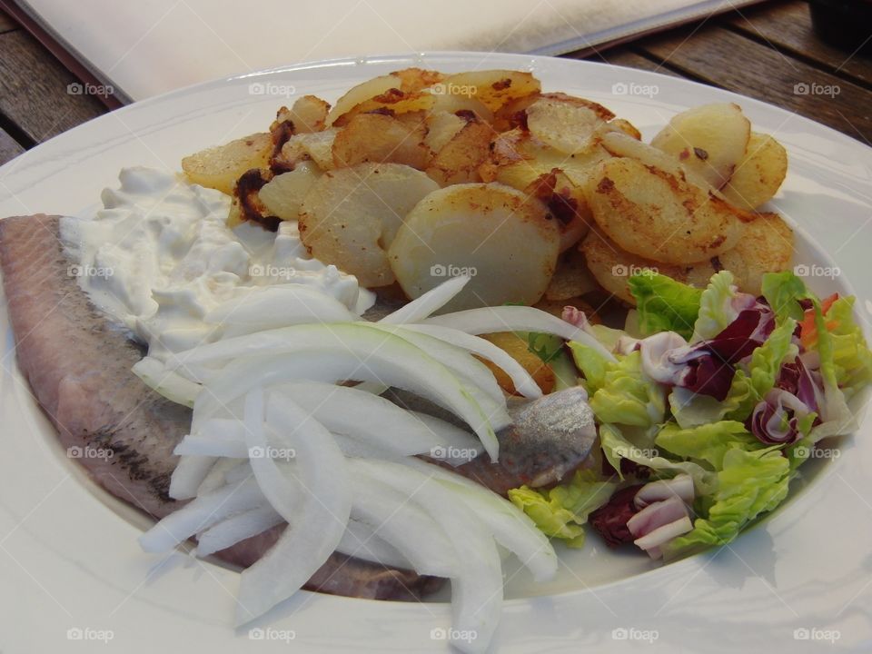 German fried hering with onions