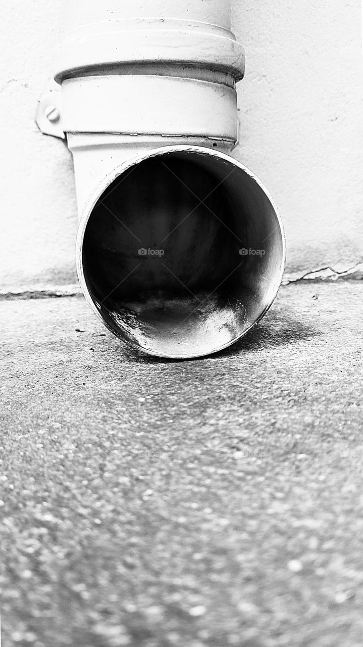 From the ground up: Rain gutter pipe.  (The frog reflecting: should I enter?) 😀😀