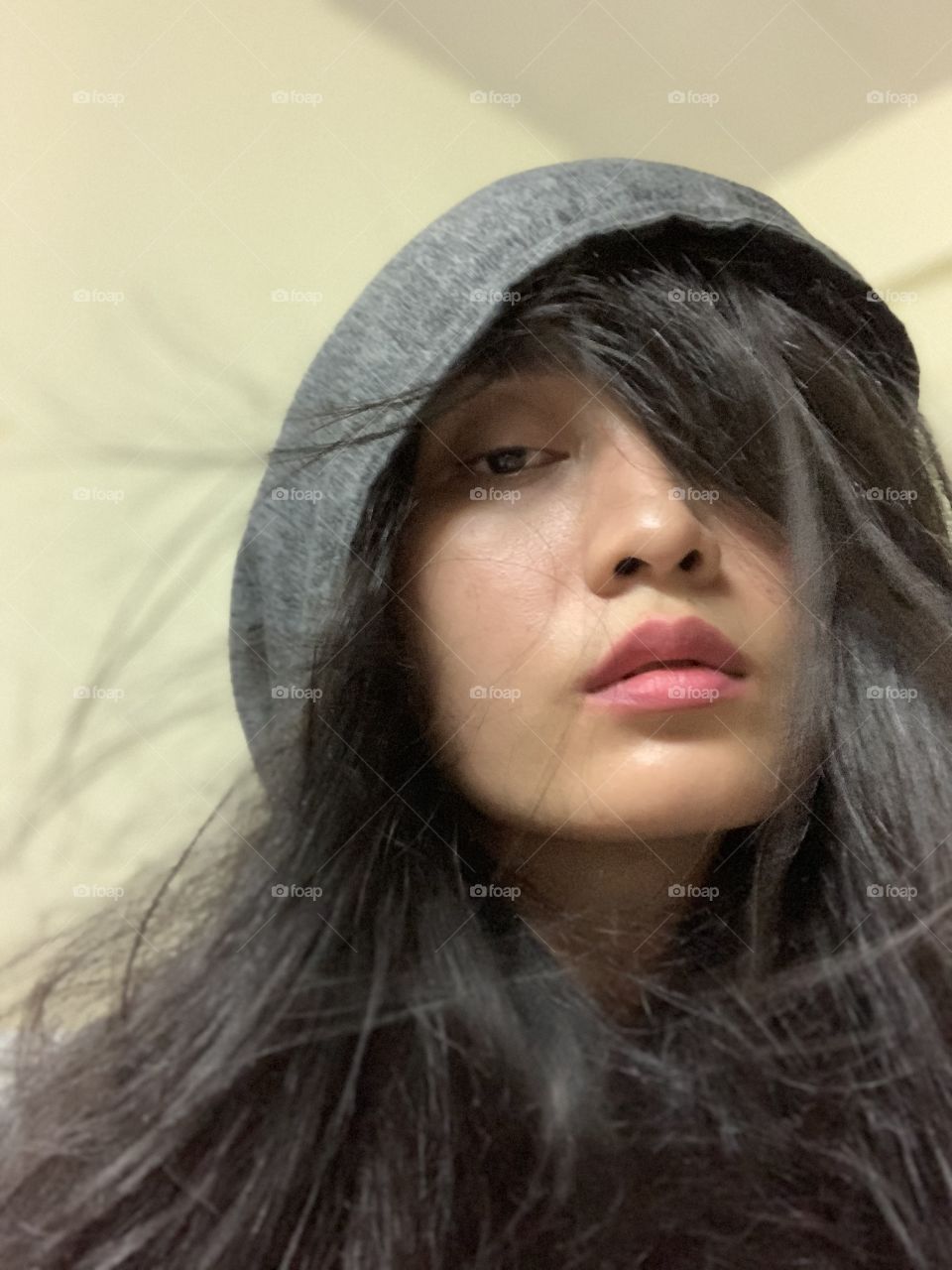 Hood and windy with long hair