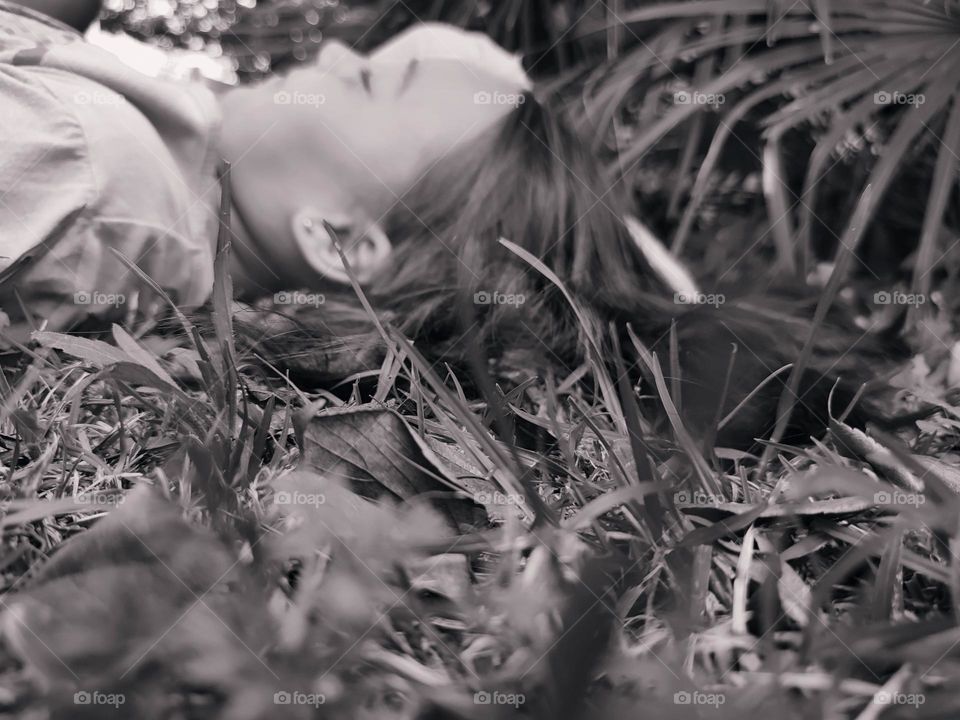 Girl lying on the grass