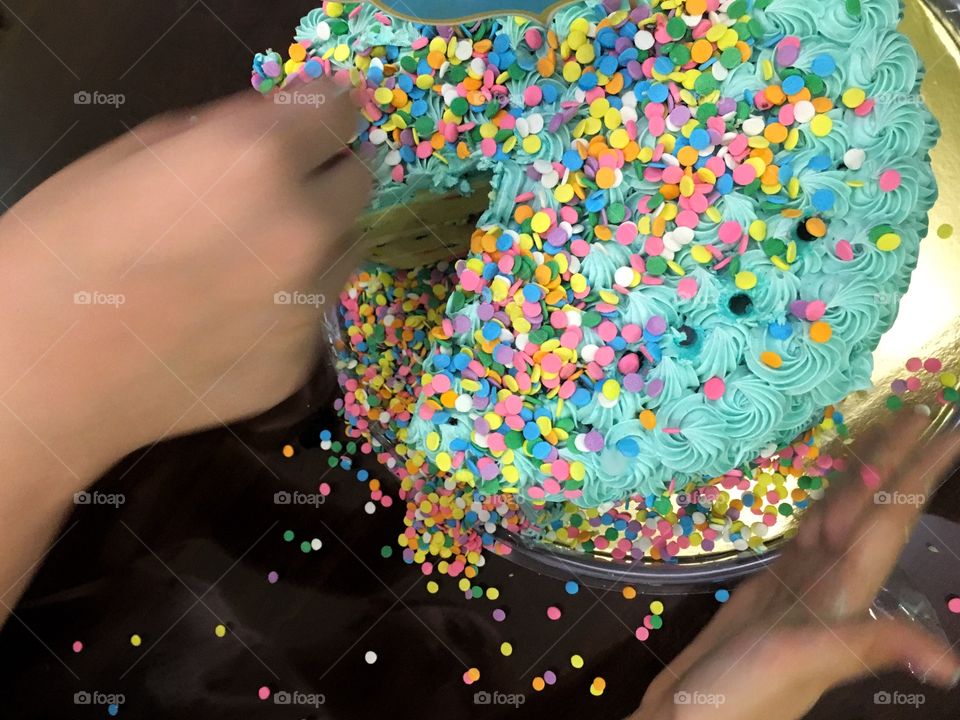 Cake was overloaded with sprinkles by the kids