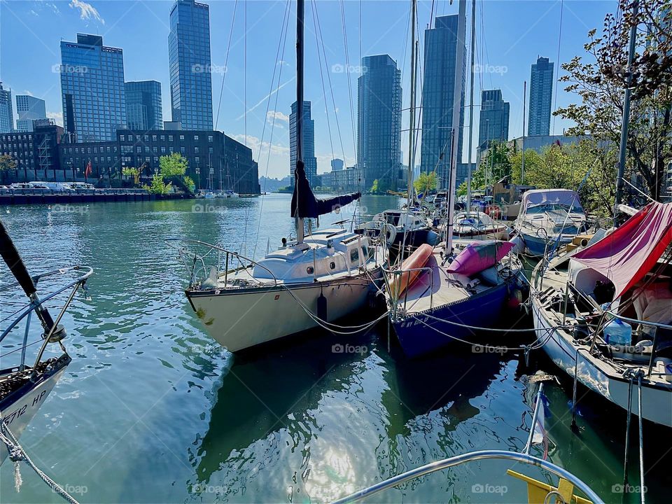This is „Newtown Creek“ by the „Pulaski Bridge“ in LIC, Queens with its great variety of boats seen from „Salvation”, the “28 foot 1969 Luhrs” cabin cruiser that I and my longtime partner “Timothy Trespas” call home. 2024. Hypnotic Productions