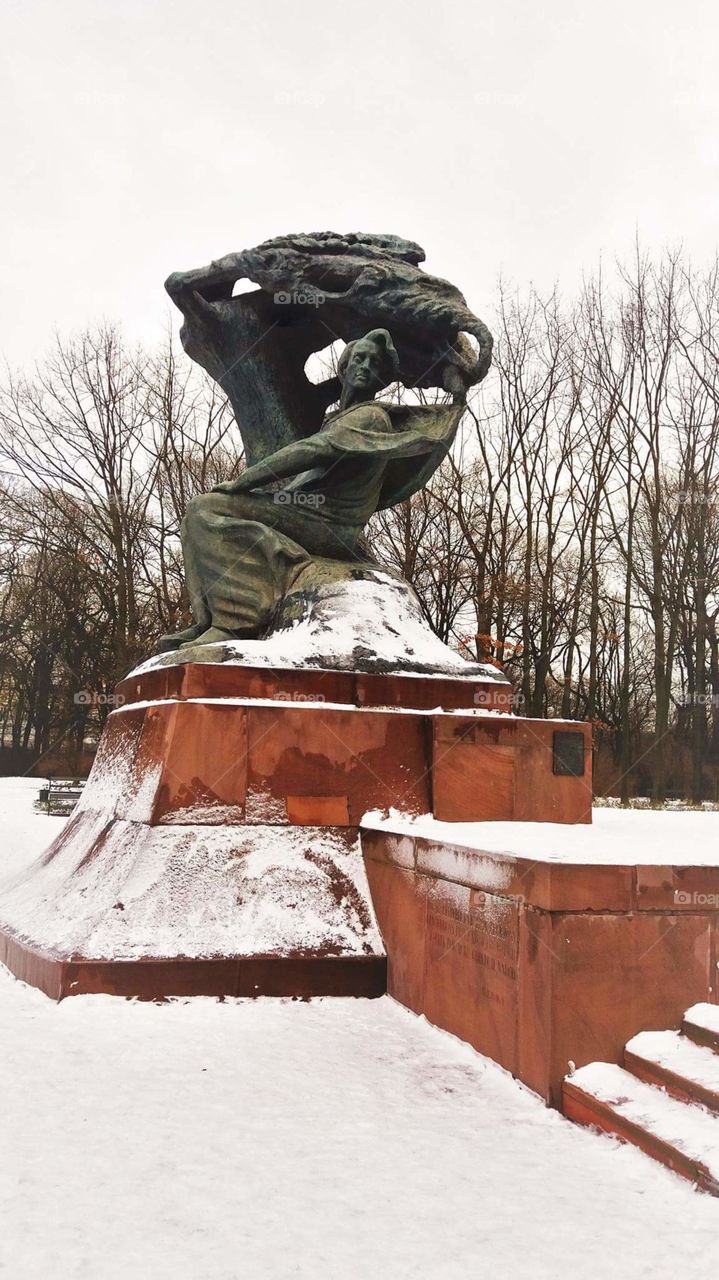 Chopin statue on Lazienki park, Warsaw, Poland