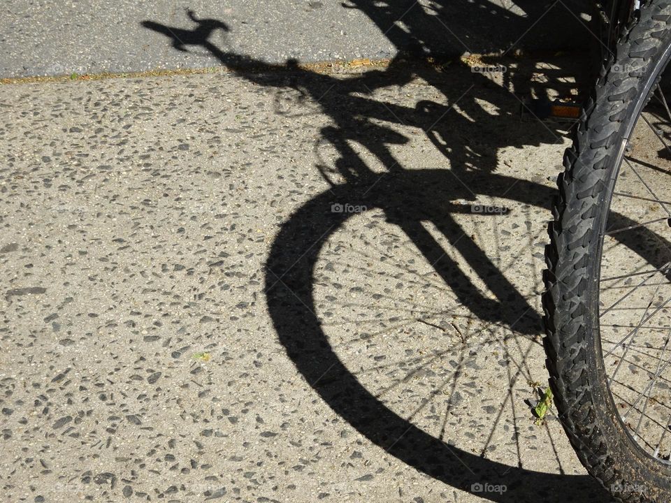 Shadow of a front bicycle.