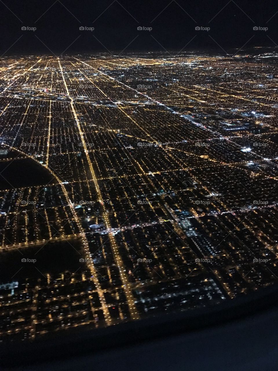 Flying into Chicago, Illinois at night 