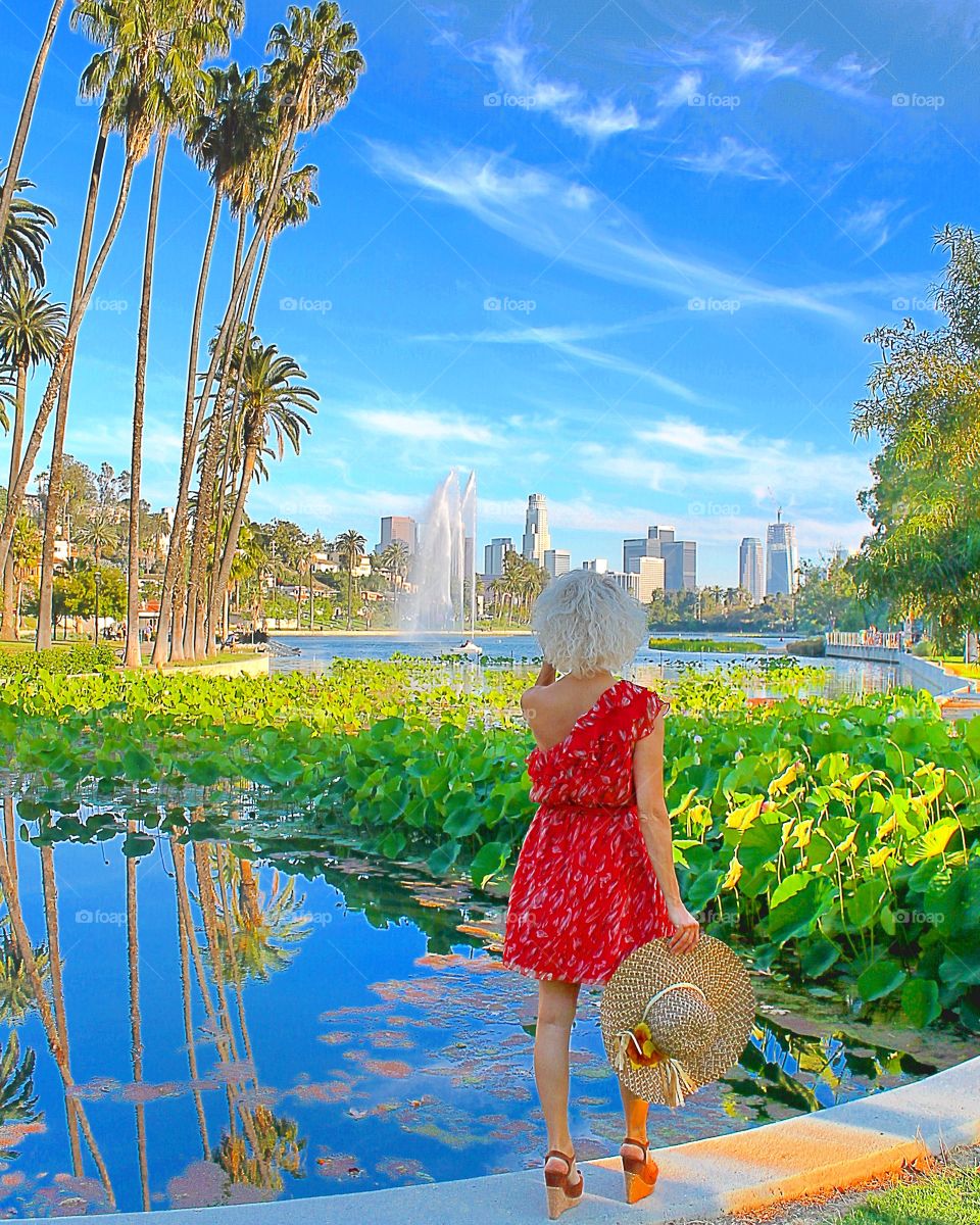 Woman in Echo Park looking buildings, Los Angeles