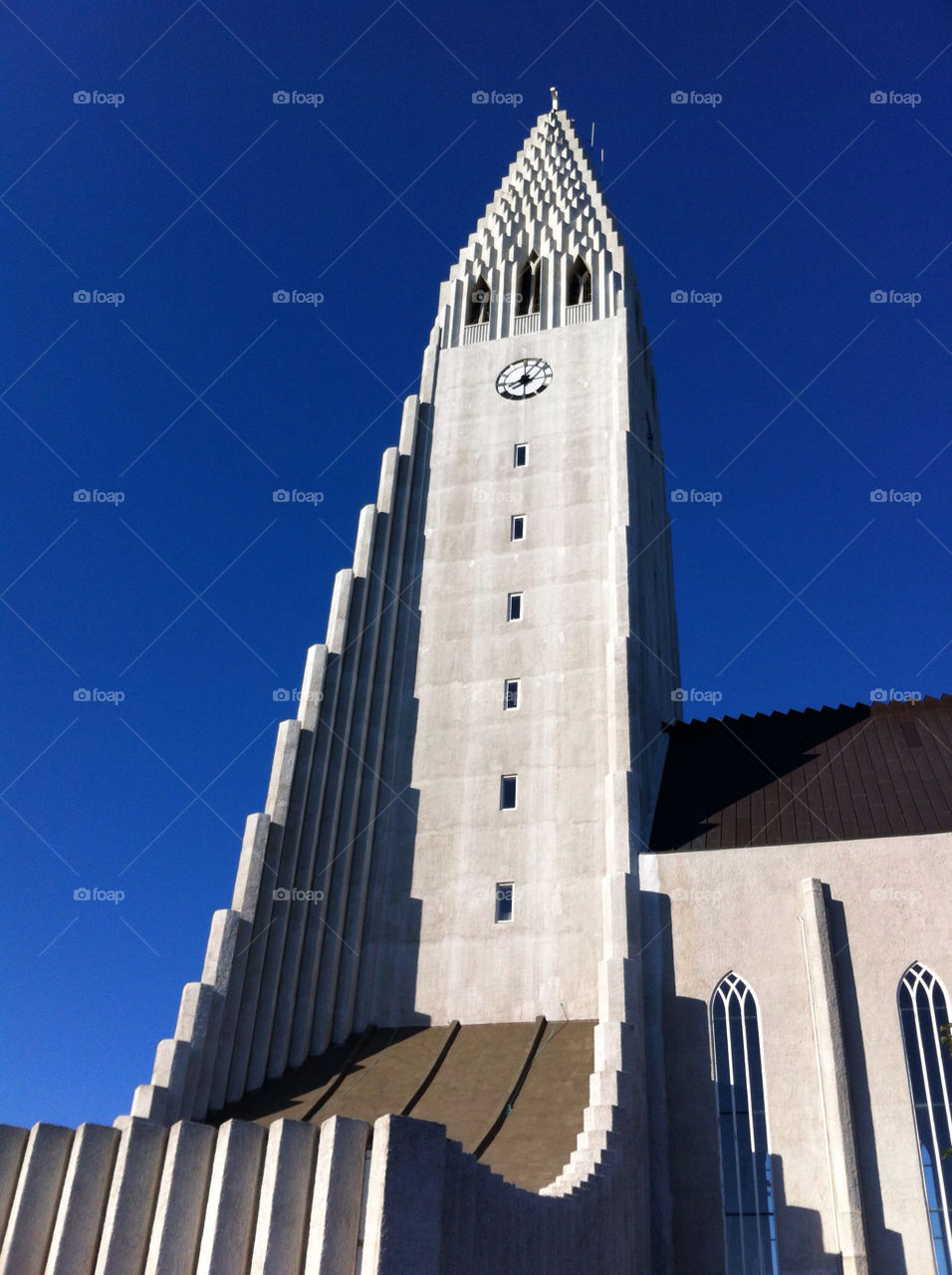 sky blue church tower by lafaeverte