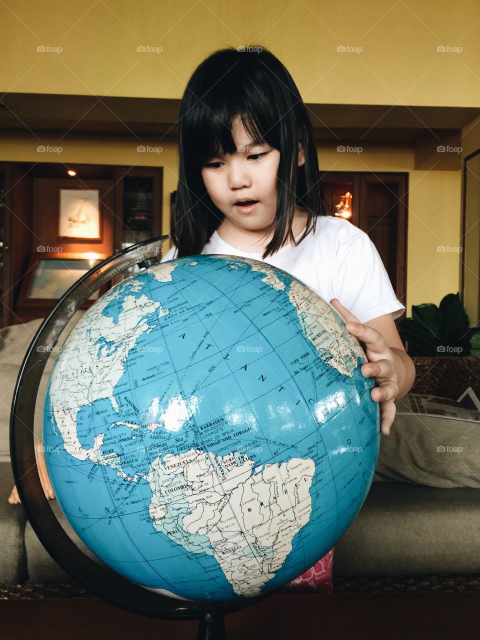little girl and the globe
