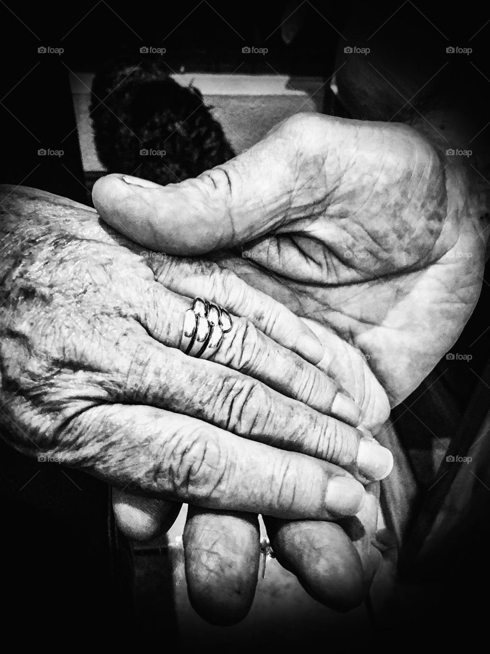 The marriage bond of 50 years. Hand in hand. Husband and wife. Holding hands. Wedding band on ring finger. 