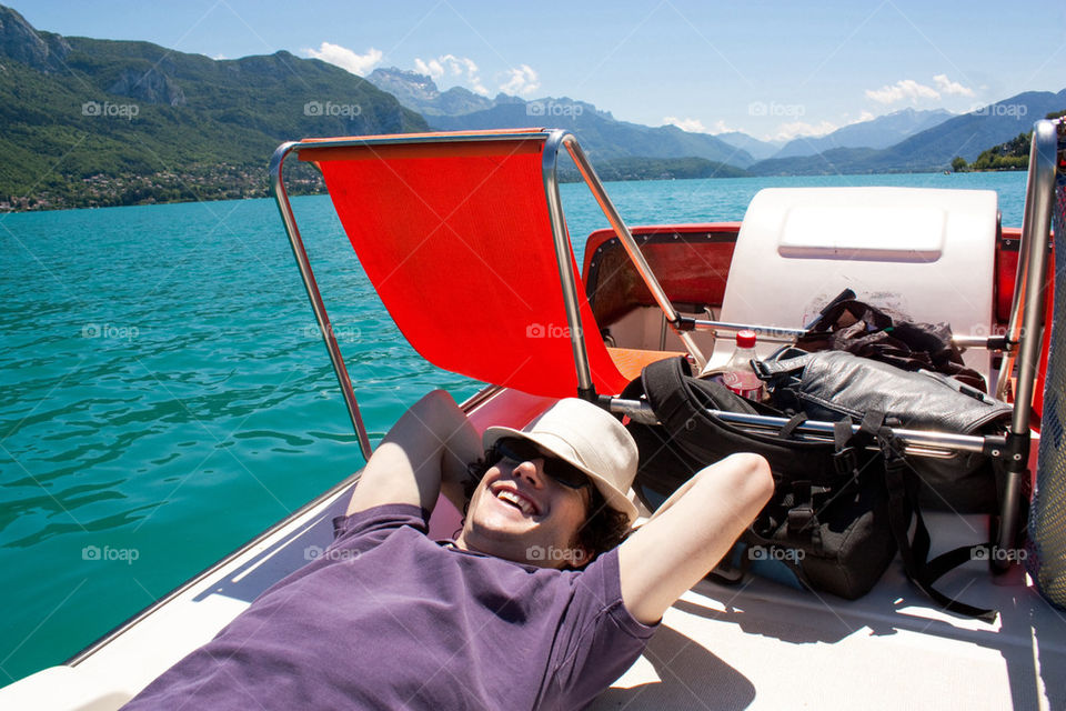 Relaxing in a paddle boat in lake Annecy 