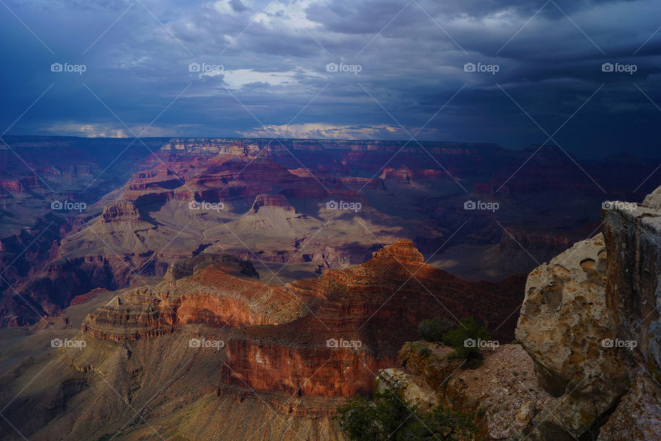 Cloudy sky over rocky mountains in Grand Canyon