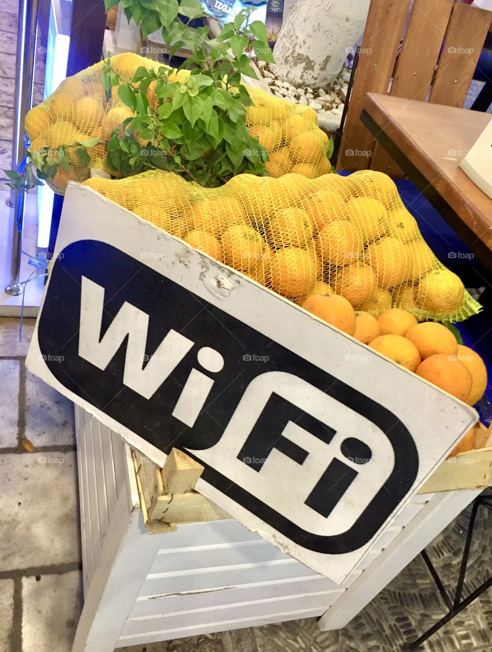 WiFi sign on wooden white box of oranges at the city market in Bodrum Turkey